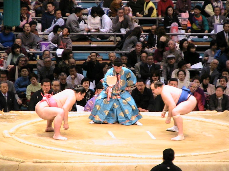 Two wrestlers getting ready to fight