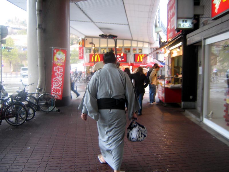 A sumo wrestler on the way to his match