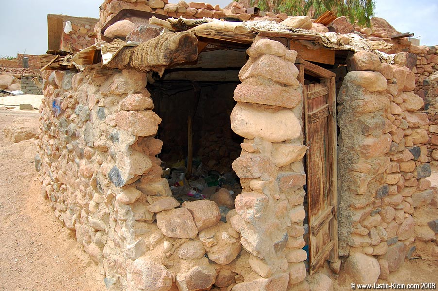 A fairly common unfinished structure – temporarily in use as a trashcan.