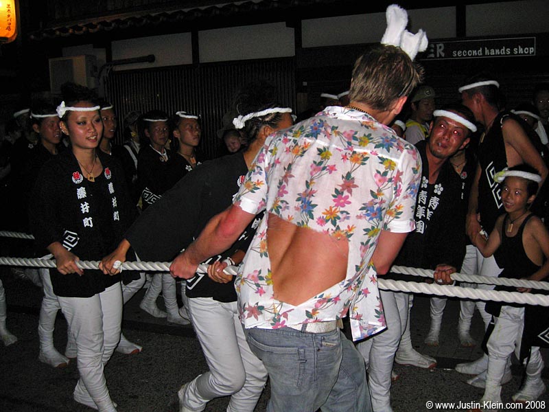 Damn.  A large portion of Peder’s favorite shirt got sucked away by the rushing crowds.  Japan maybe safe…but the Danjiri Matsuri is far from it.