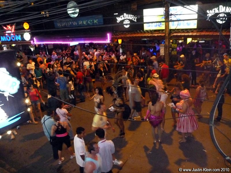 Looking down on Bangla Road from a 2nd-floor bar.  Countless scantily-clad ladyboys plow the streets posing for photos and peddling their “services.”