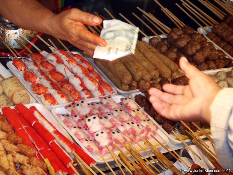 Minced-fish skewers shaped like little cartoon characters. Where am I, Japan?