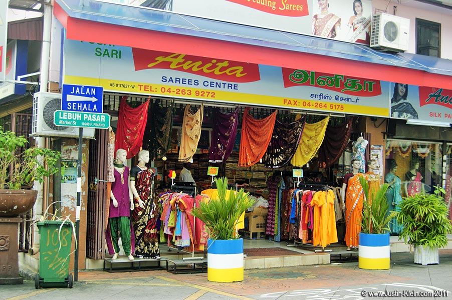 Rainbow-colored saris for sale.