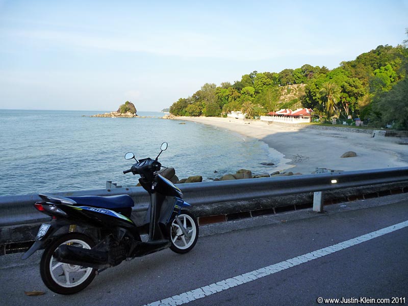Skimming the coast outside Batu Ferringhi.